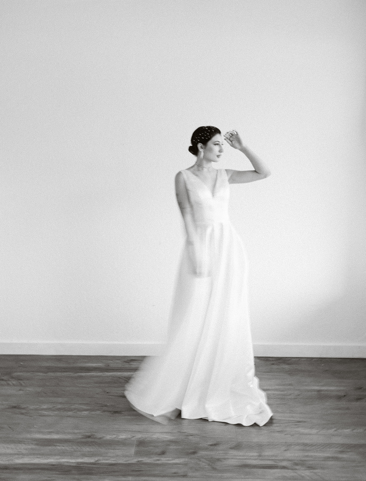 A bride in her modern gown moves in motion