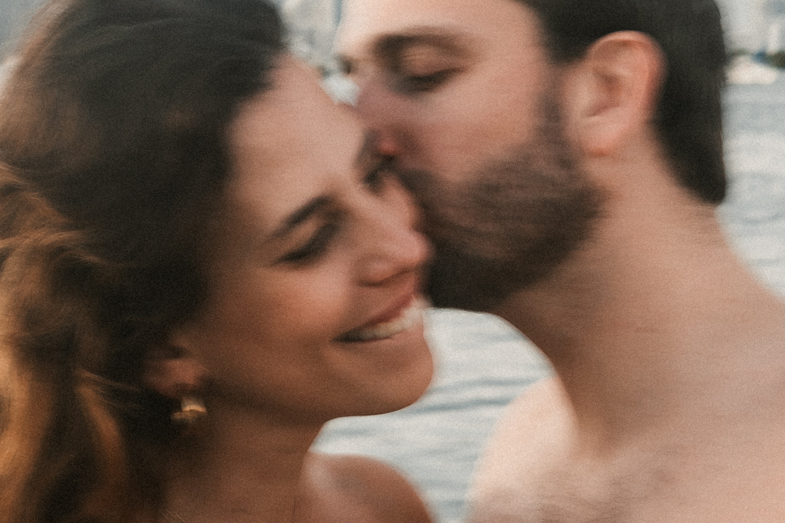 A couple kissing, blurry shot.