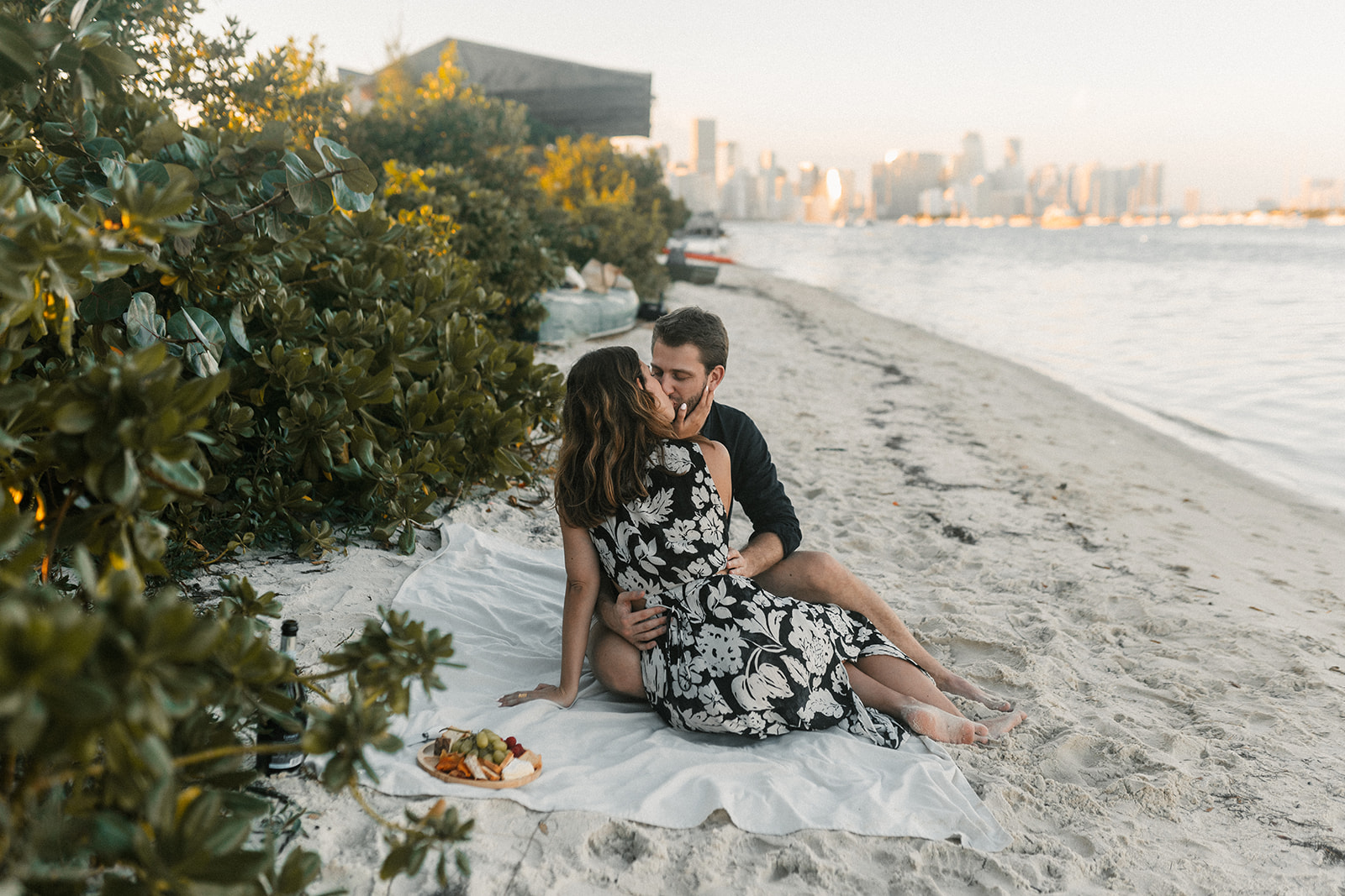 A couple having a romantic picnic at the beach in Miami Beach.