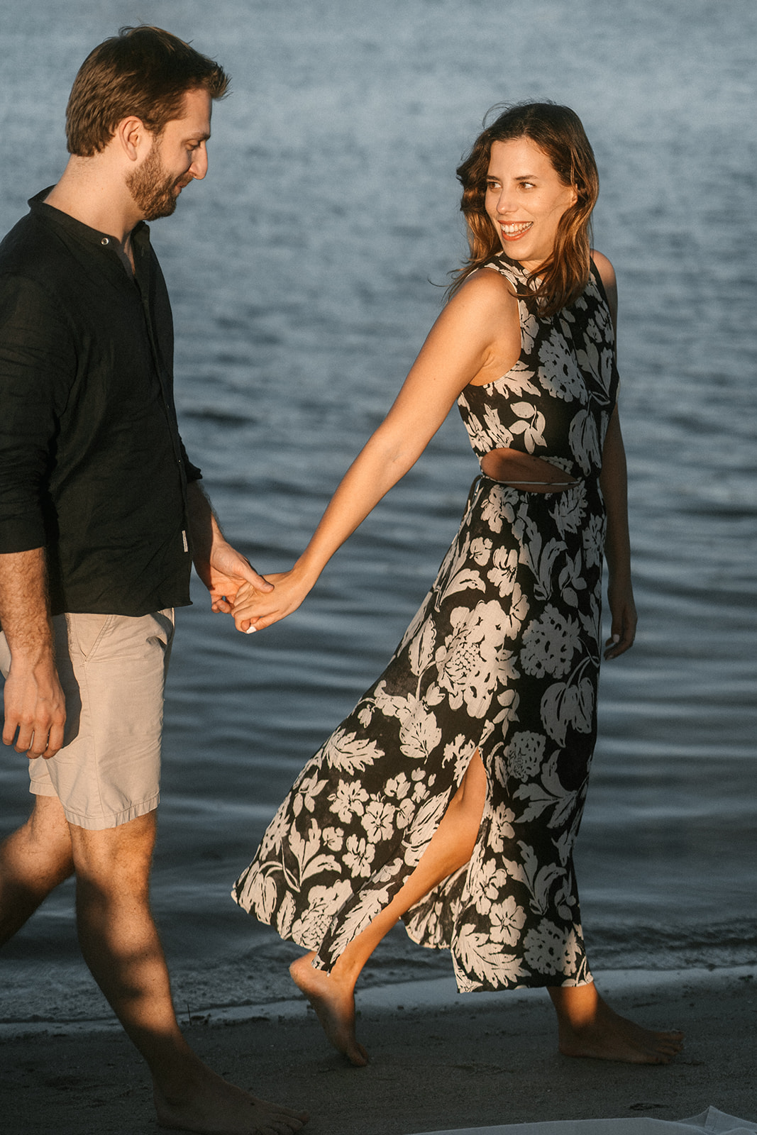 A couple taking a romantic walk in Miami Beach.