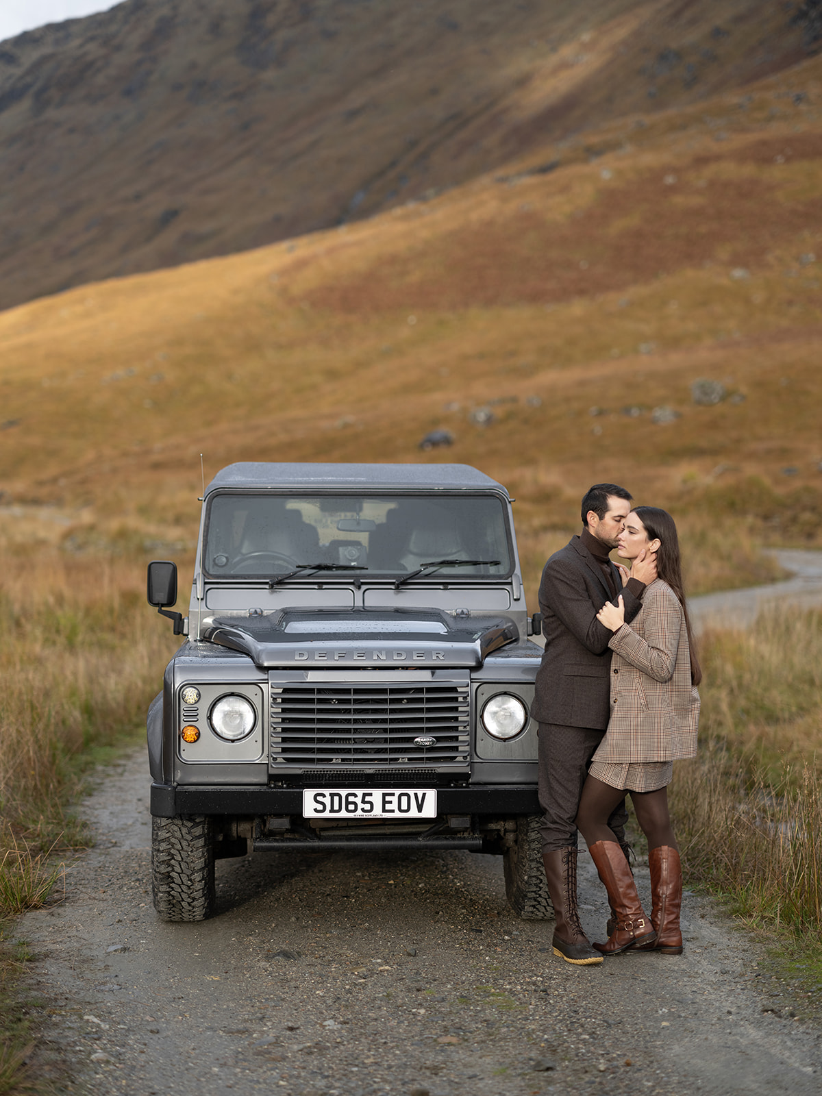 Couple taking their engagement pictures at Glen Dessary Estate in Scotland.