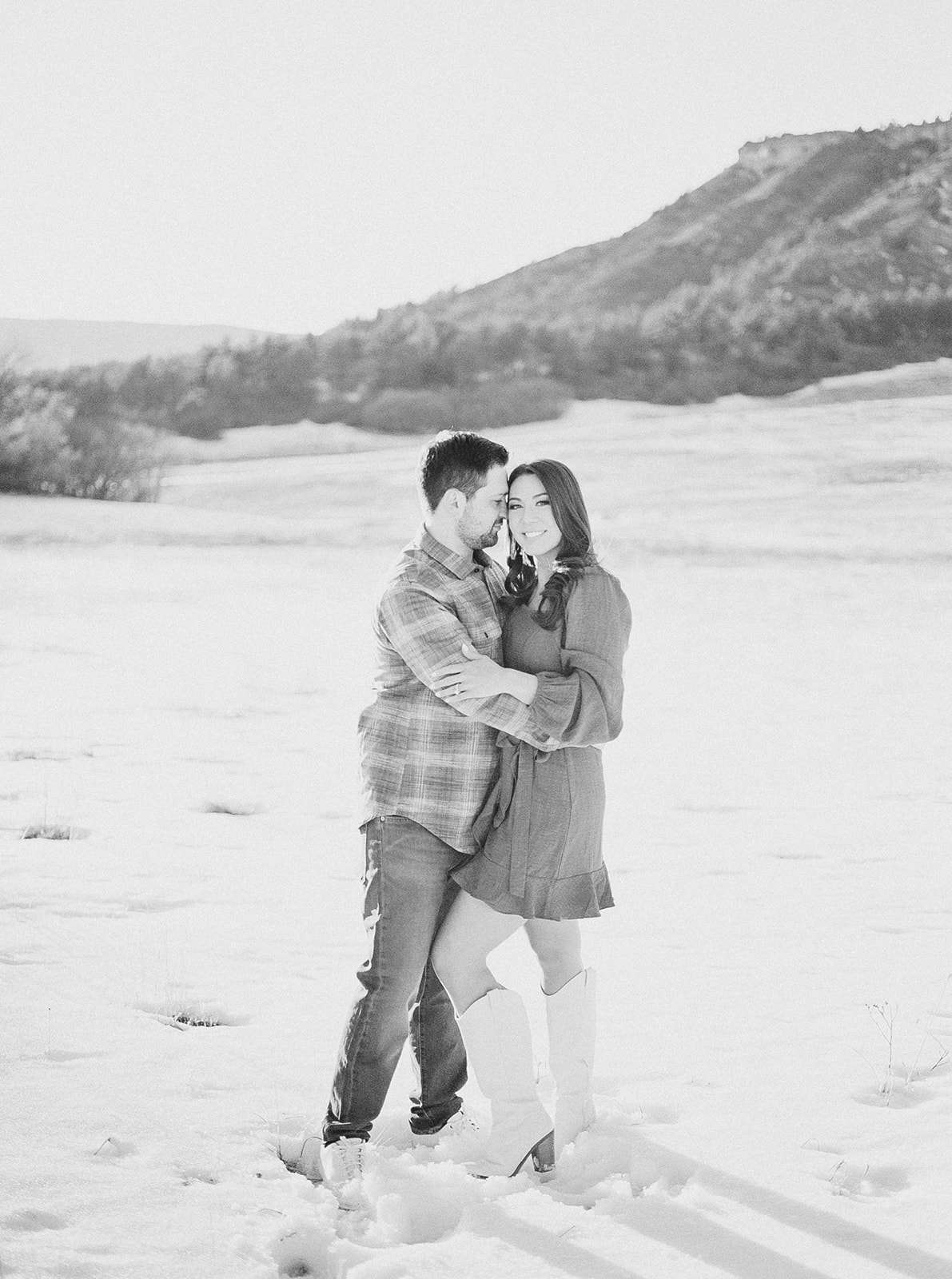 Black and white image of couple in mountain setting in Castle Rock, Colorado