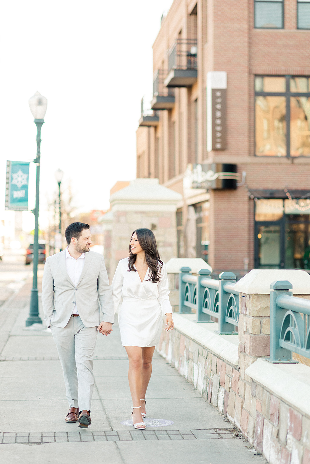 Film image of couple in Castle Rock engagement photos, white dress and gray suit