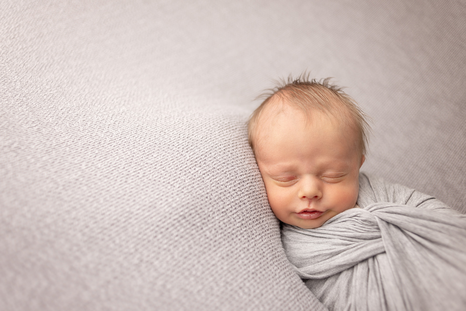 baby boy newborn professional pictures with neutral colors in carthage, missouri