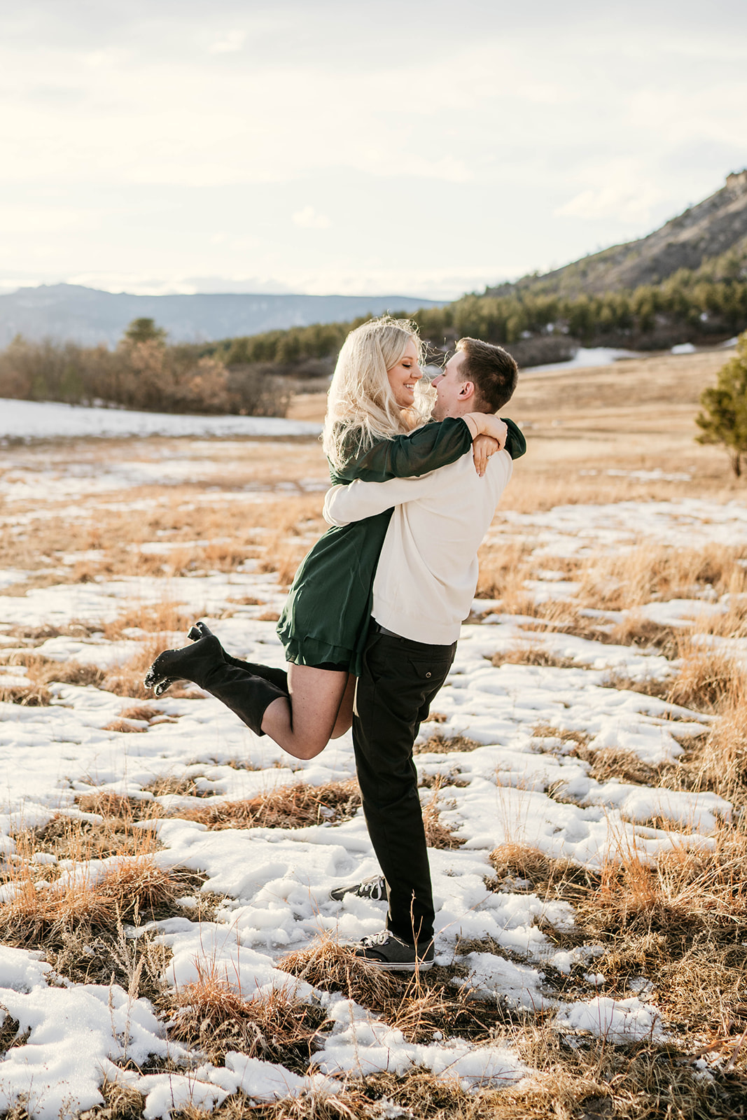 Couple engagement session during golden hour with beautiful mountain views in Castle Rock, Colorado