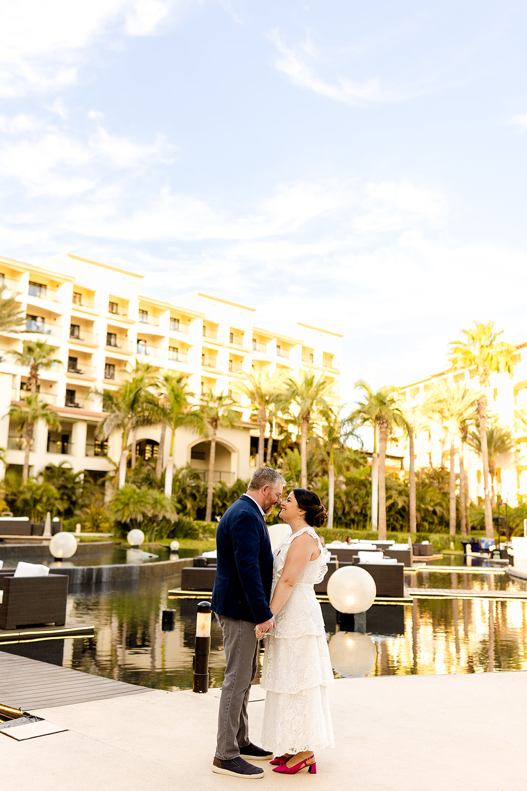 couple holding hands and kissing at Hyatt Ziva Los Cabos