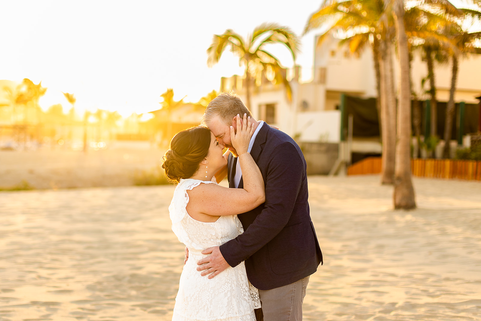 Man and woman going forehead to forhead and hugging on the beach