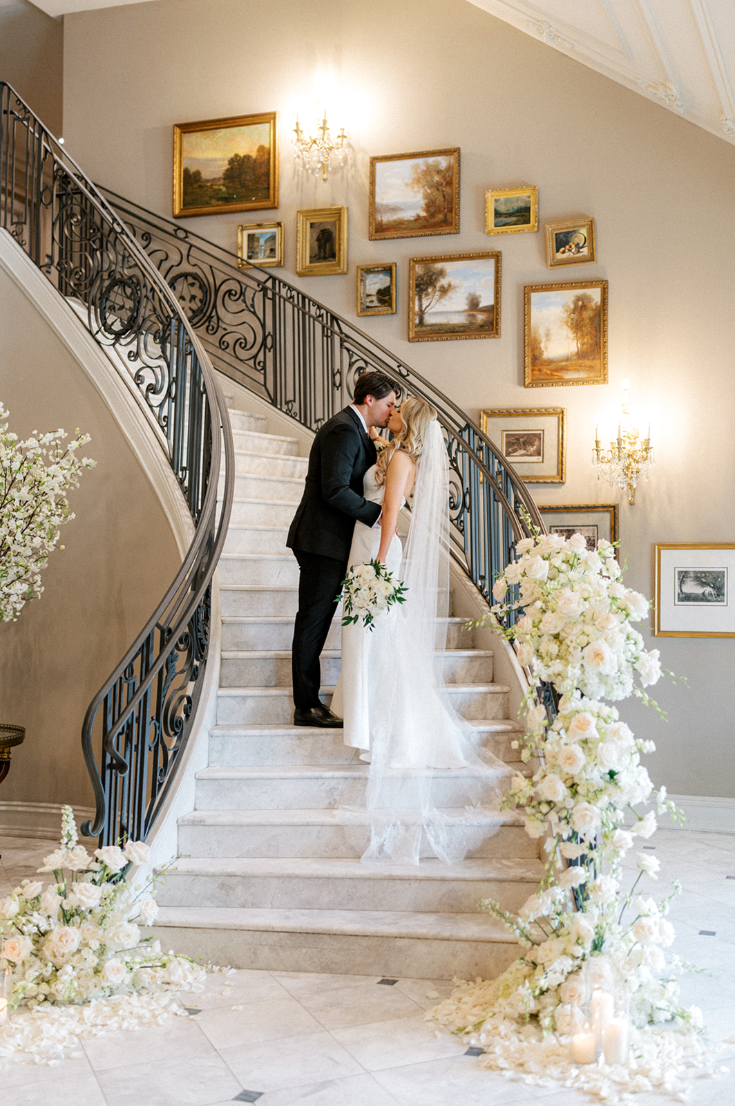 Bride and groom on grand staircase at Park Chateau wedding
