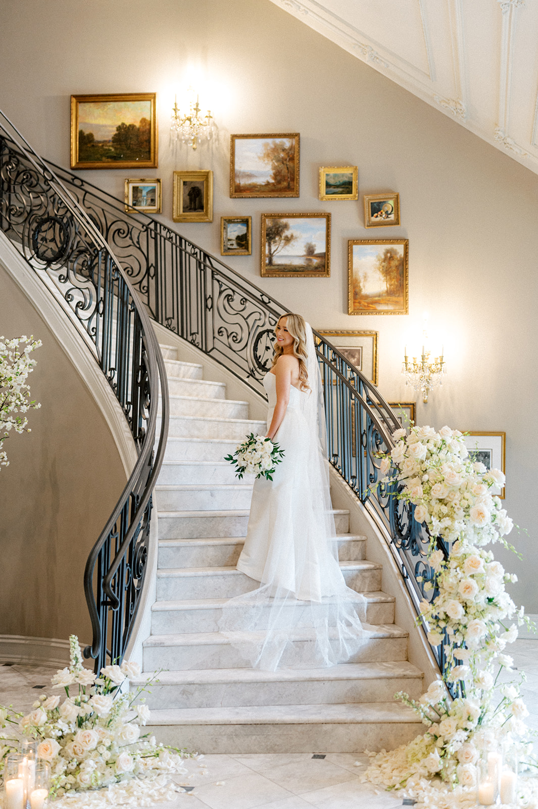 Bride on grand staircase at Park Chateau wedding