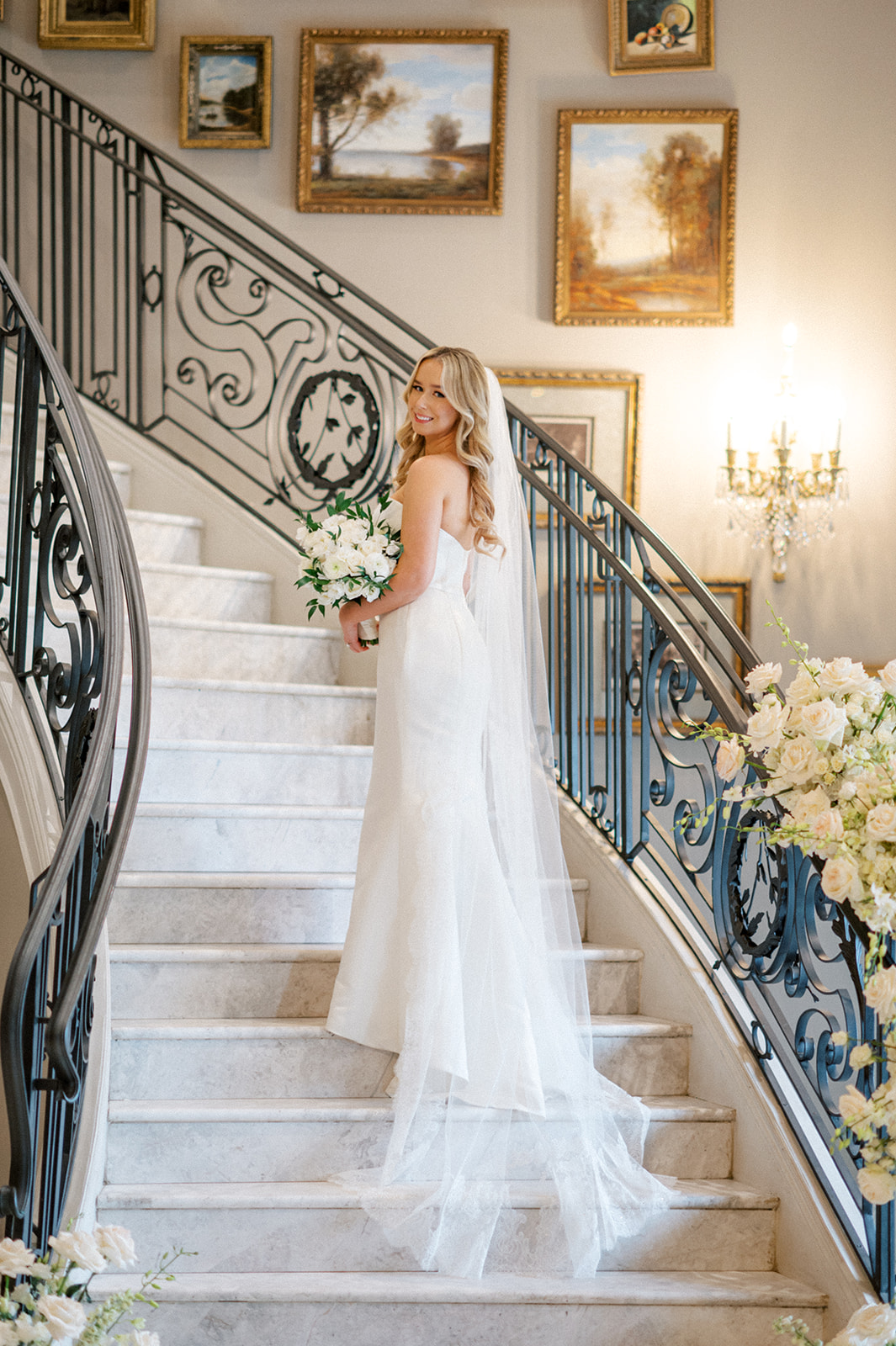 Bride on grand staircase at Park Chateau wedding