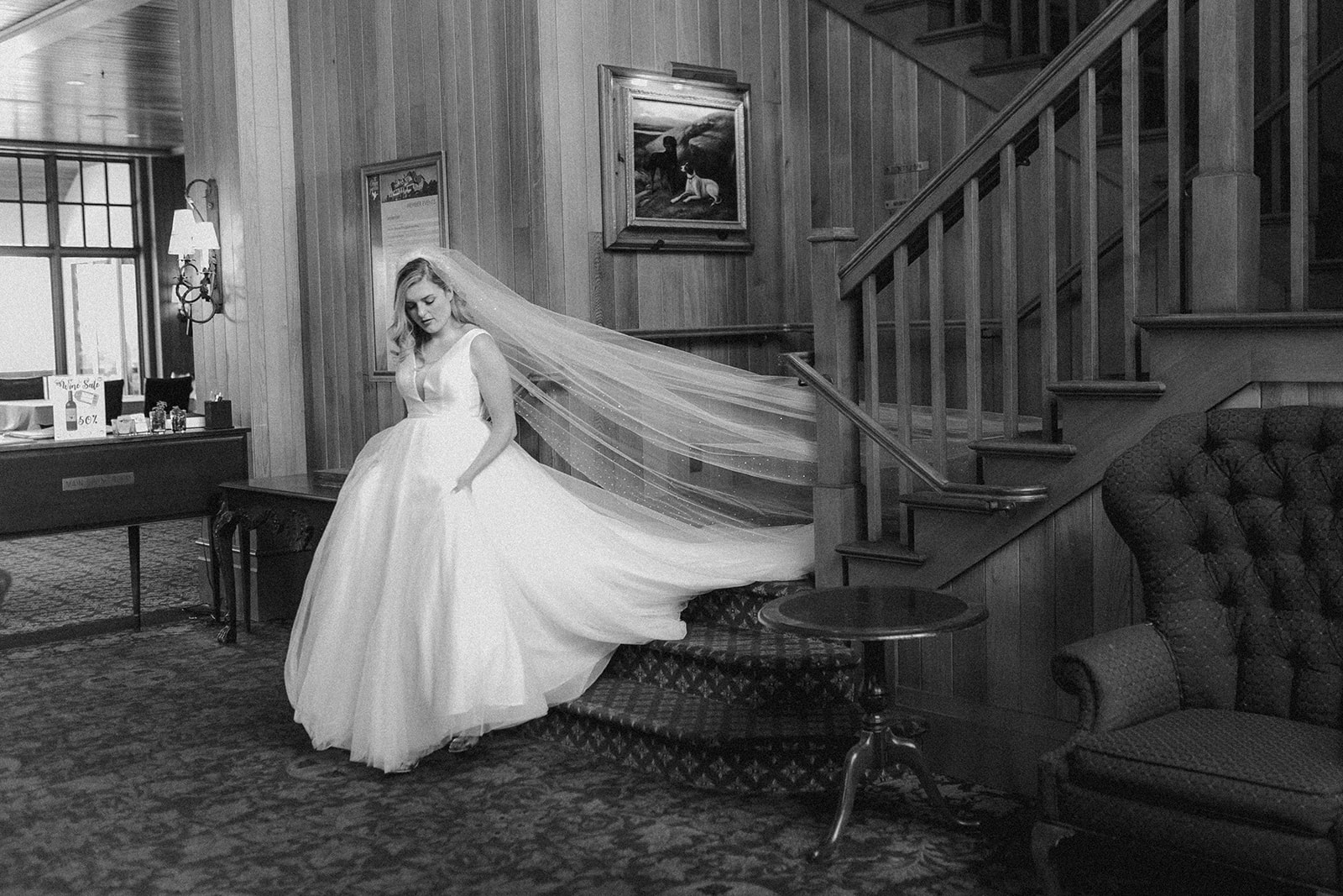 A bride coming down the stairs from the bridal suite inside at the Oregon Golf Club.