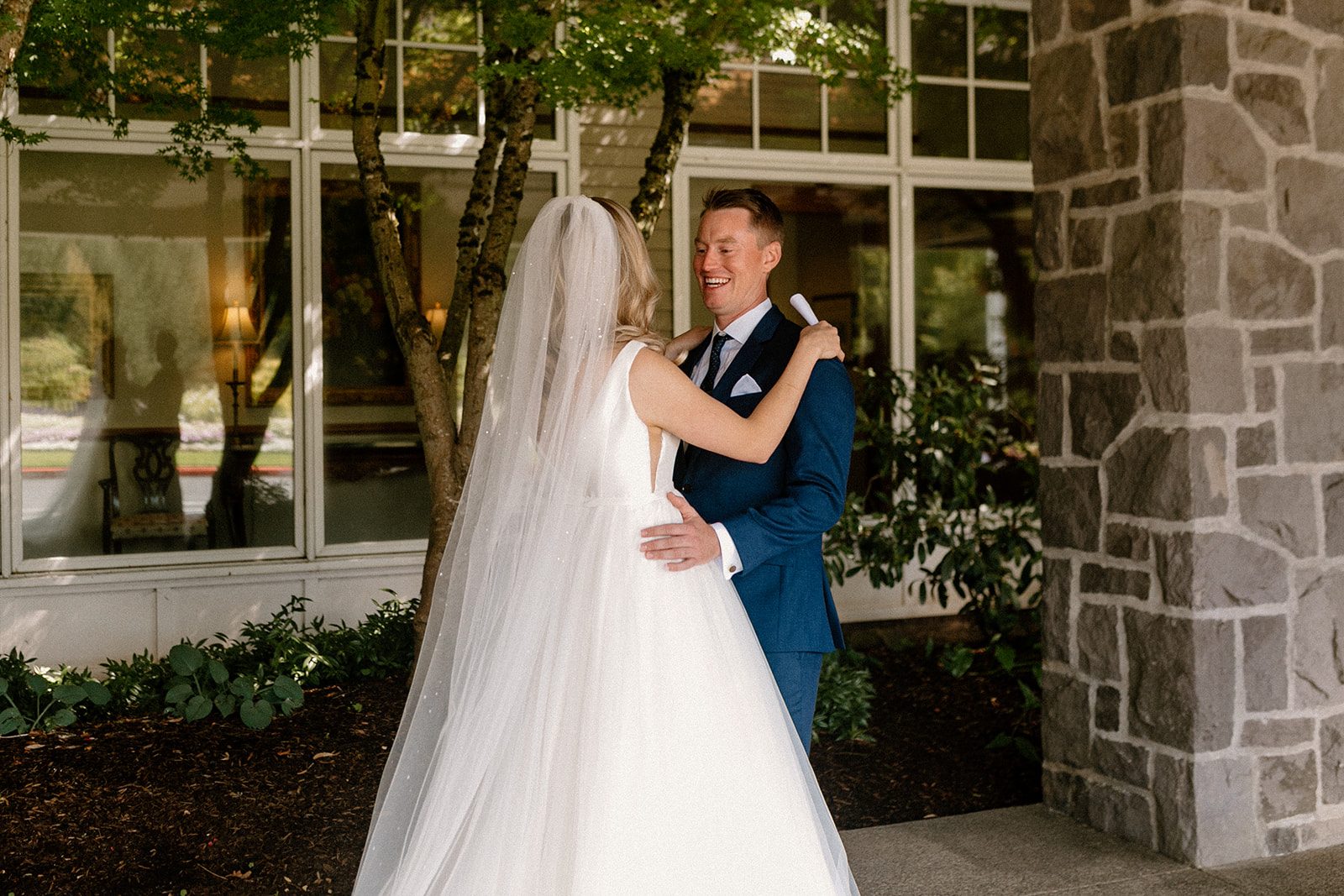 A bride and groom have an emotional first look at their Oregon Golf Club wedding. 