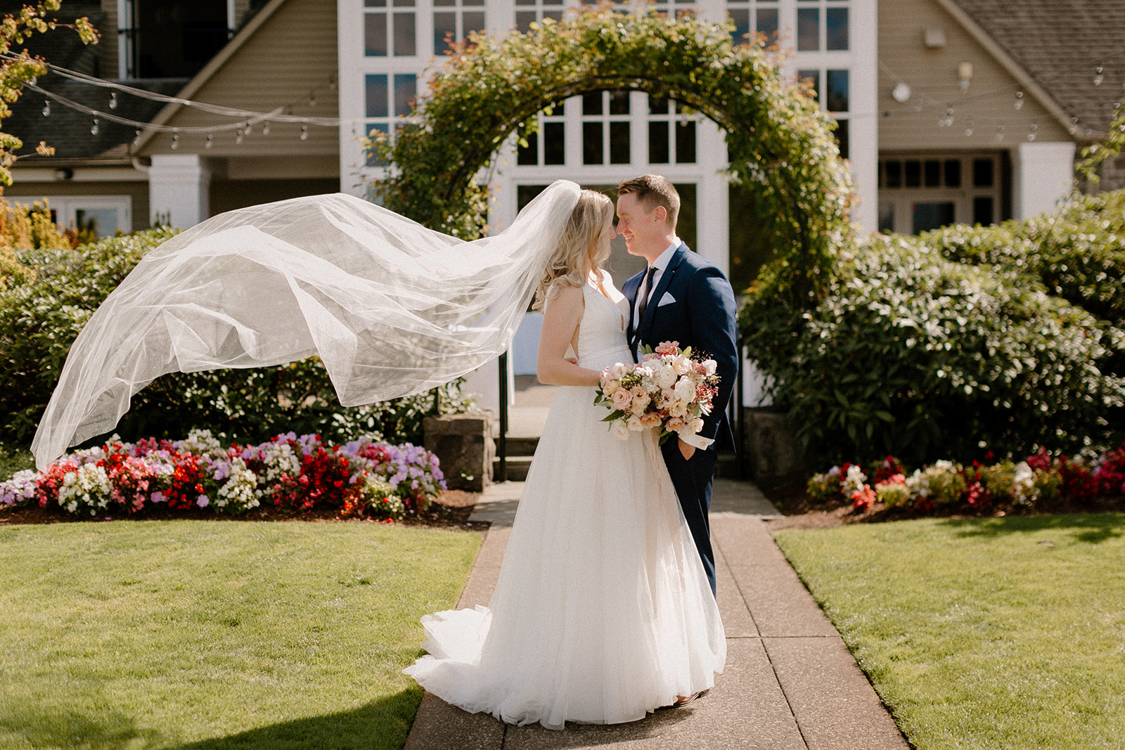 A bride and groom share a sweet moment outside at The Oregon Golf Club.