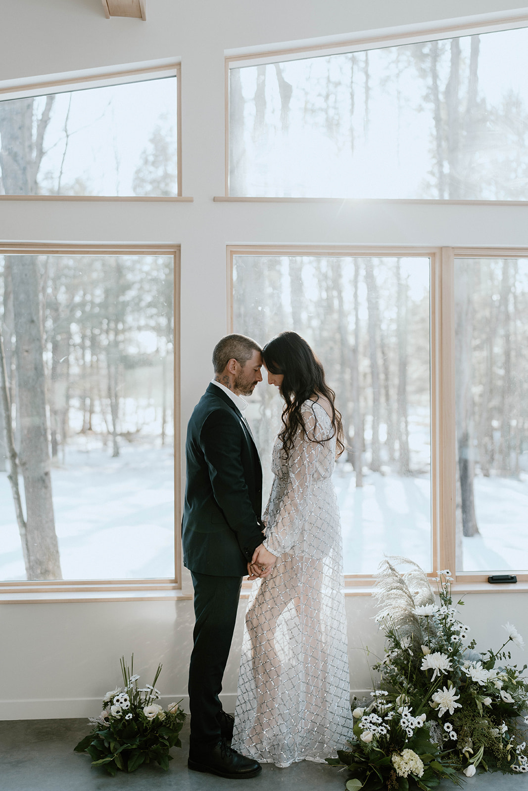 intimate wedding ceremony with bride and groom at a wisconsin cabin.