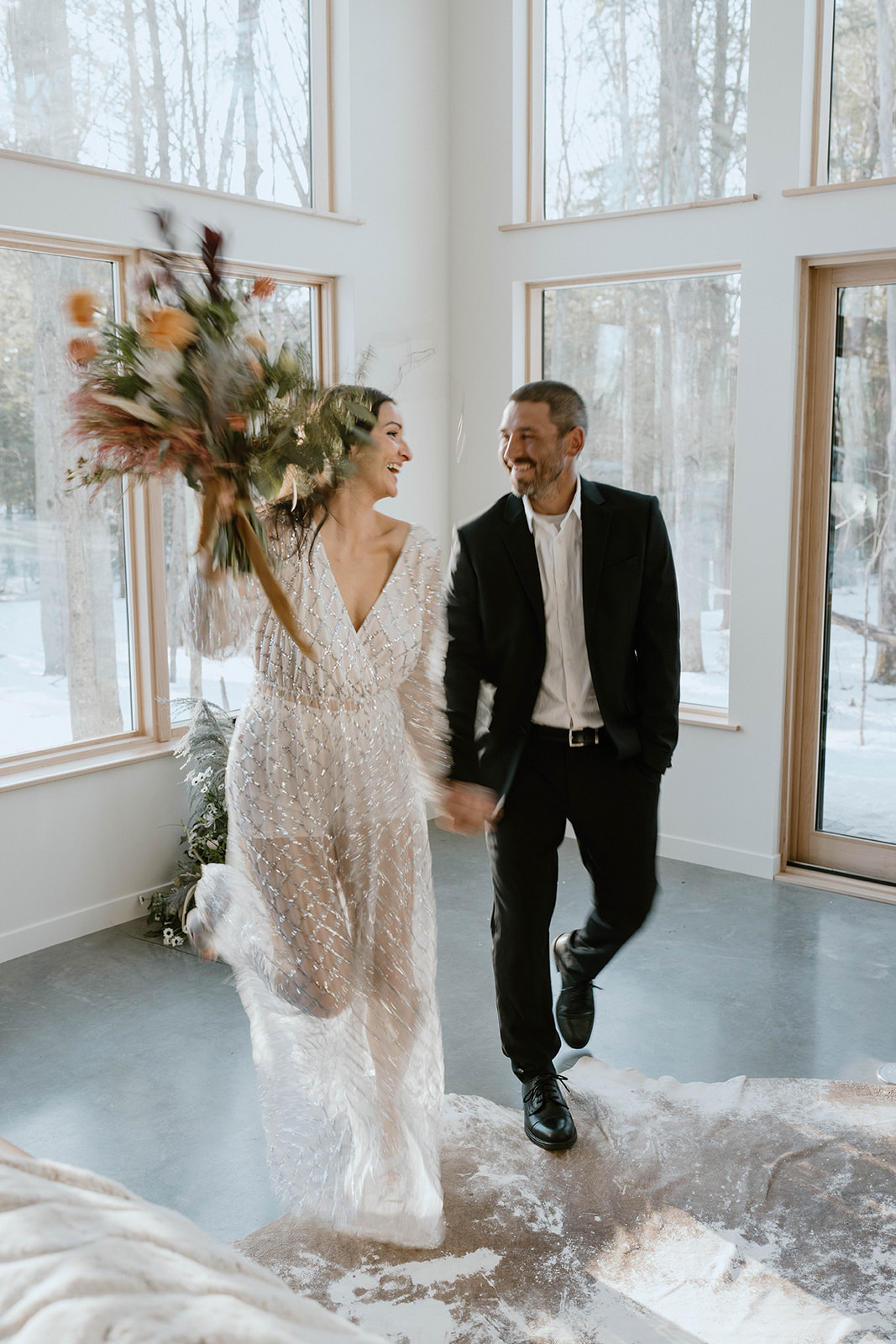 intimate couple walking together with a beautiful bouquet of flowers