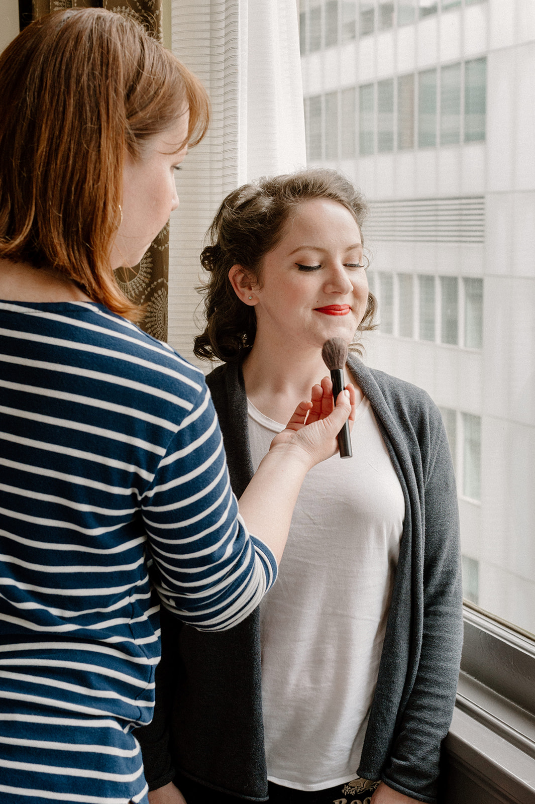 A bride getting ready for her Portland courthouse elopement at the Royal Sonesta Portland Downtown.