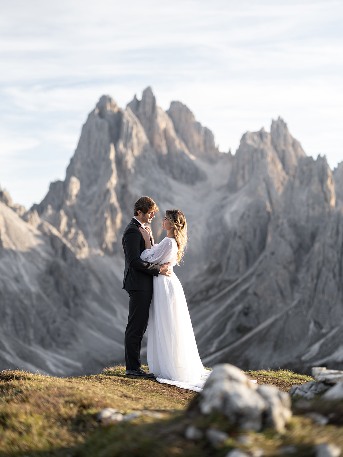 bride and groom looking at each other on wedding day in the dolomites Italy 