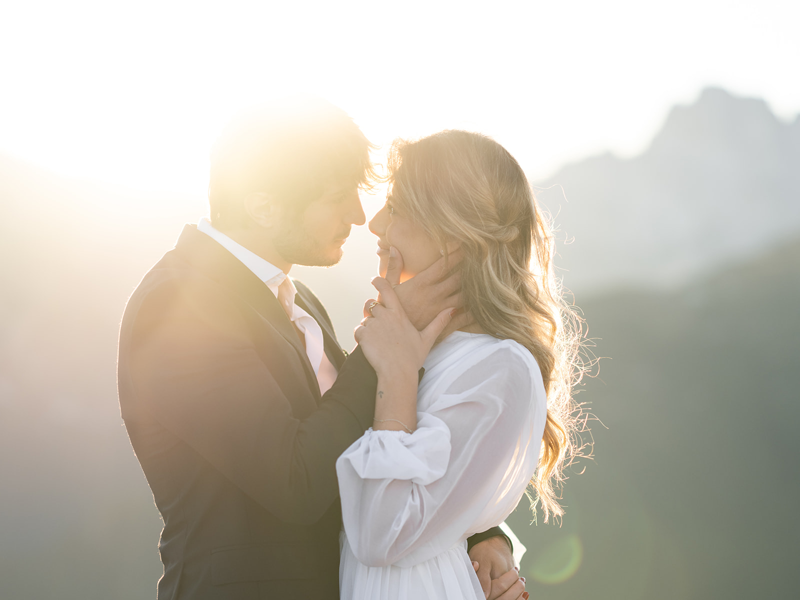 bride and groom share a sunset kiss during their adventure elopement in Italy at the dolomites 