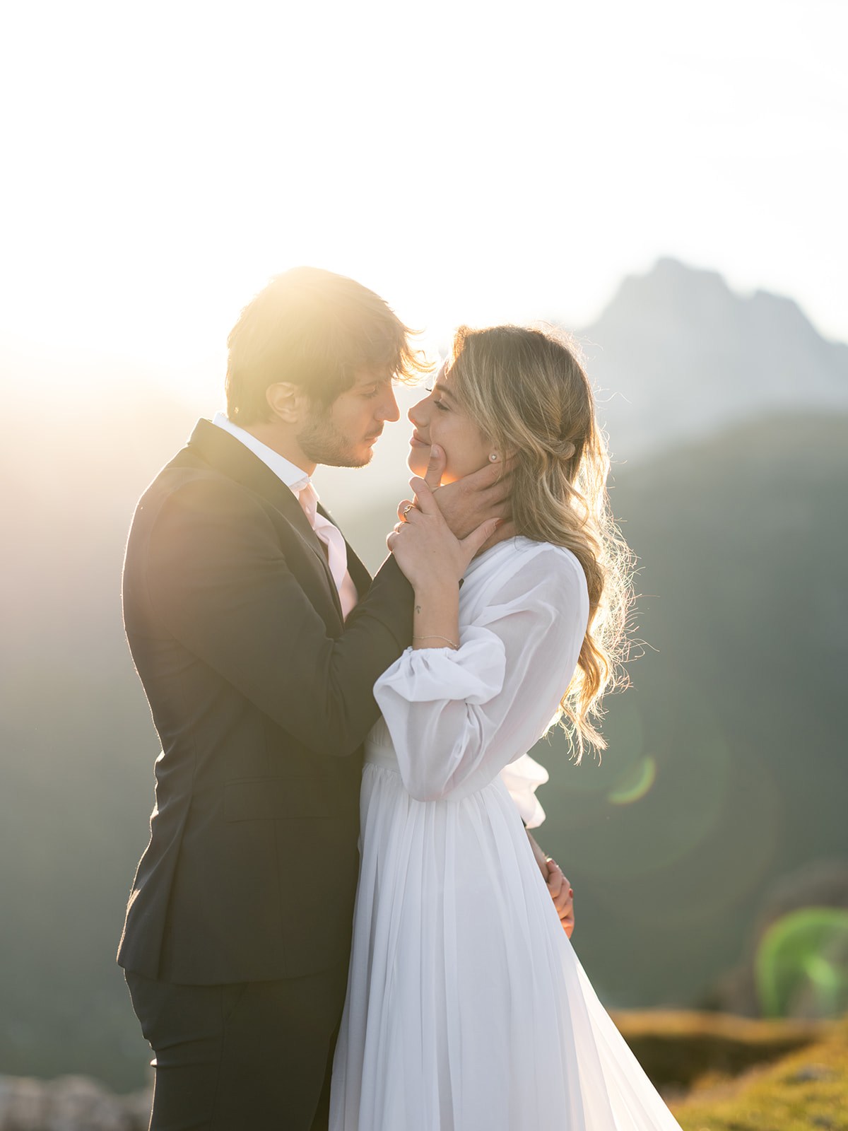 bride and groom about to kiss at sunset during their elopement in the dolomites 