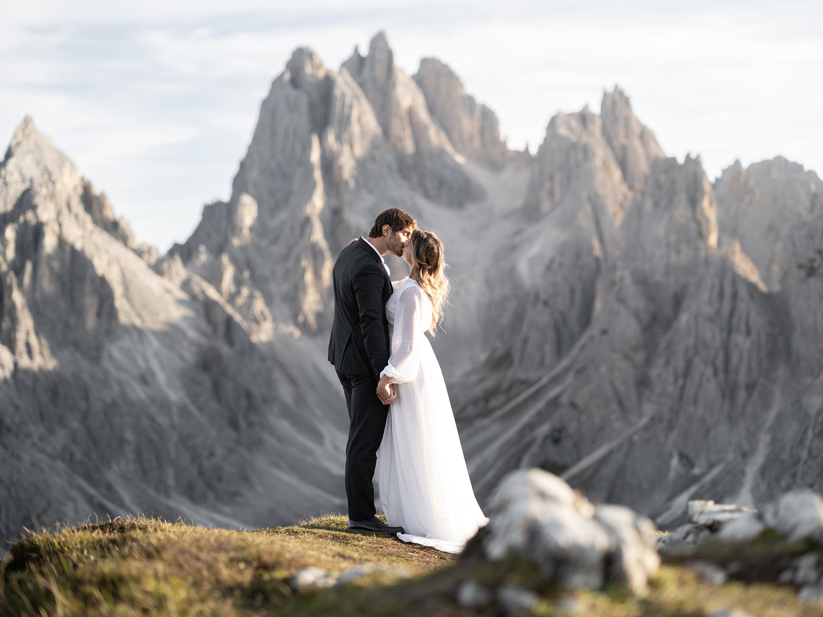 Couple kissing at their wedding in the Dolomites in Italy 