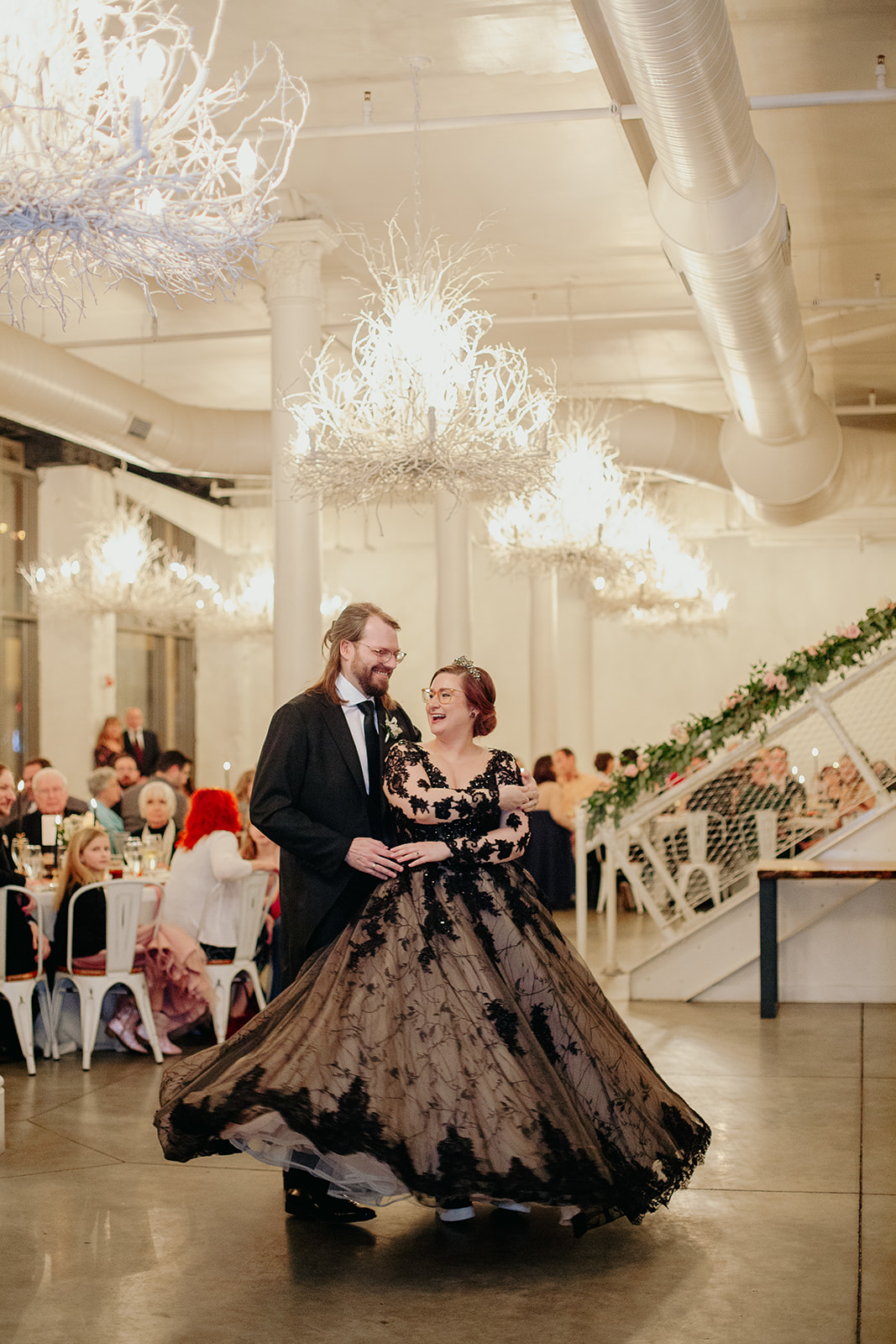A whimsical couple shares their first dance as husband & wife