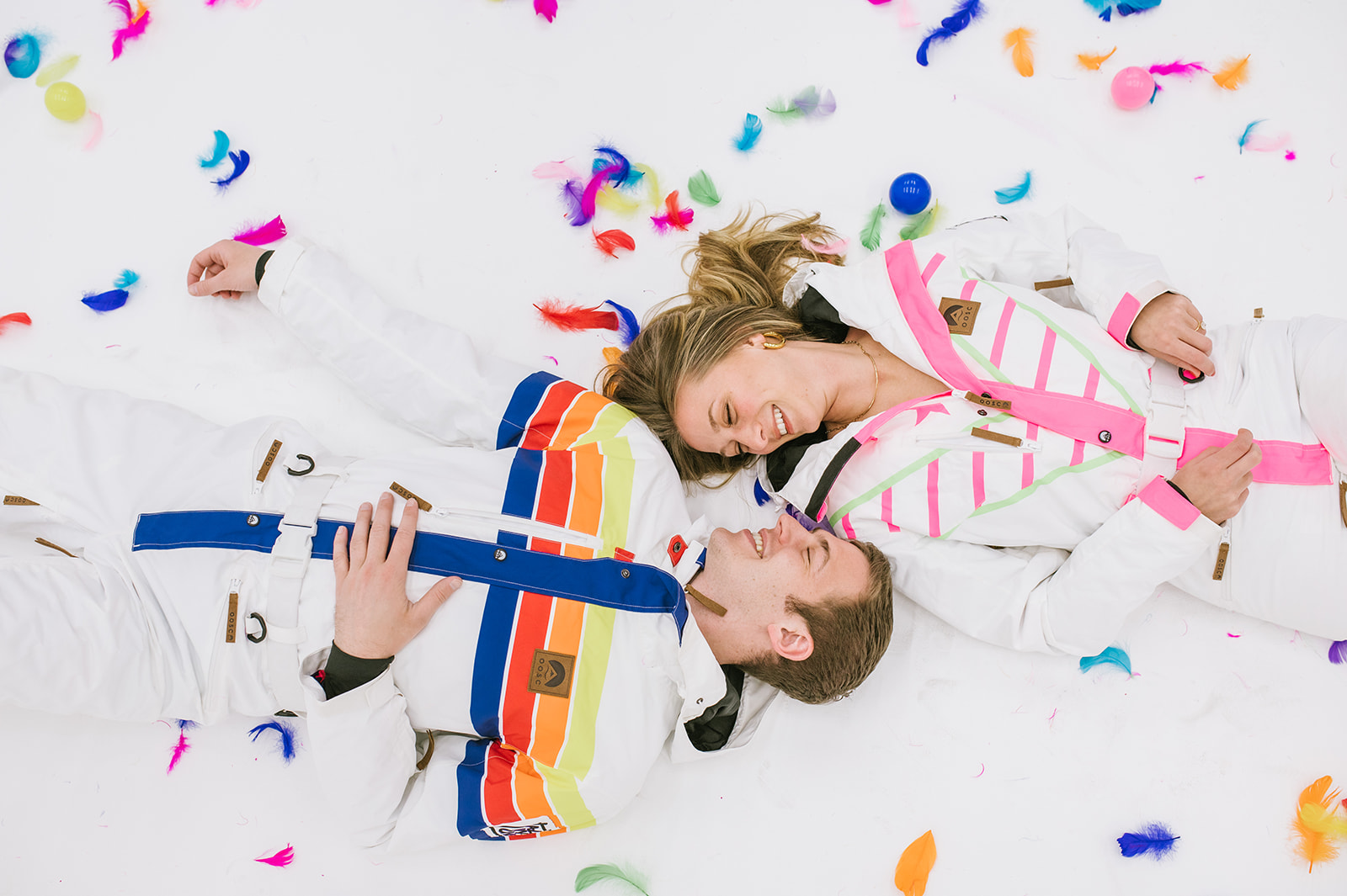 Creative  NYC engagement photoshoot in studio with retro outfits and confetti