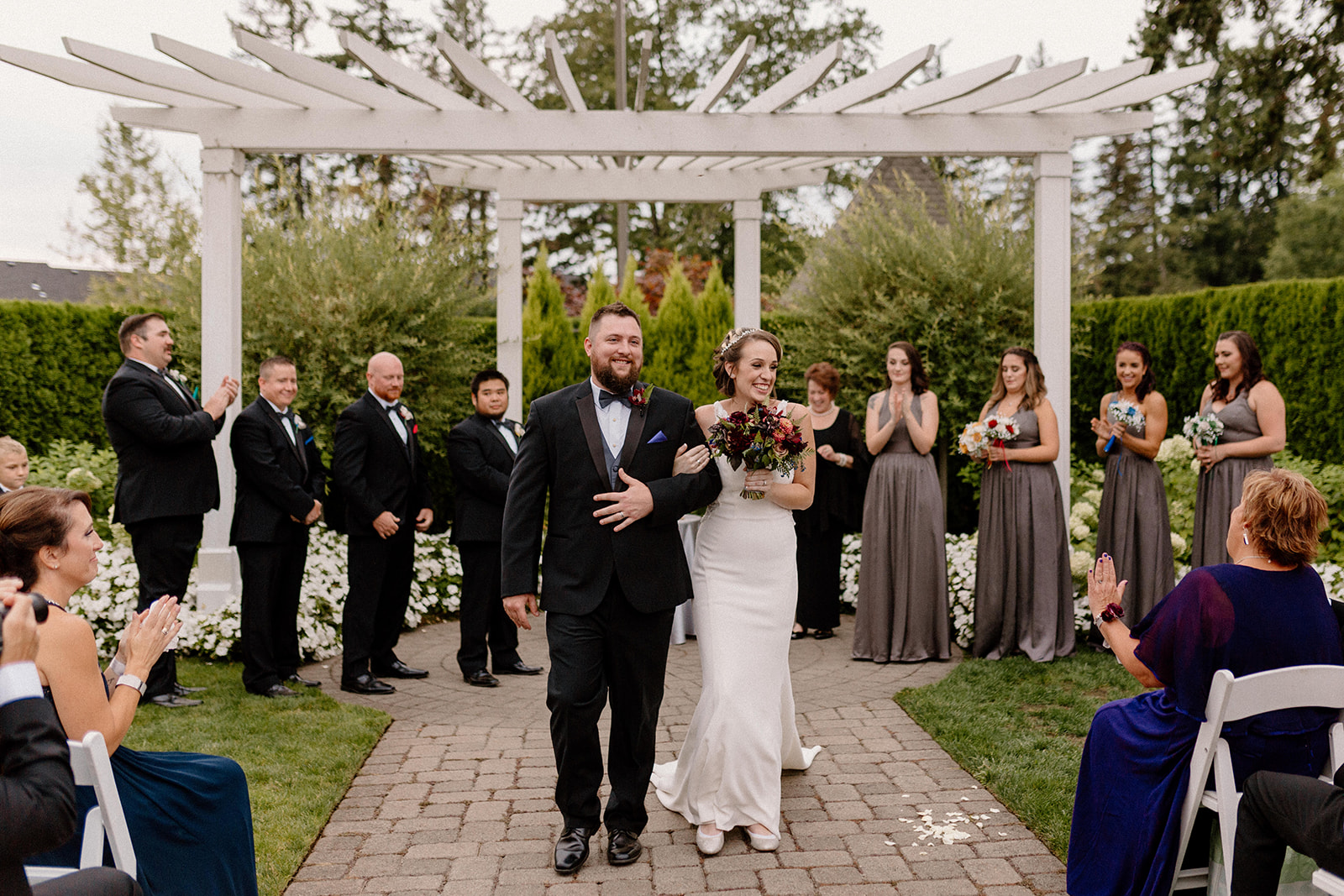 A bride and groom walk down the aisle after their wedding ceremony at The Aerie at Eagle Landing. 