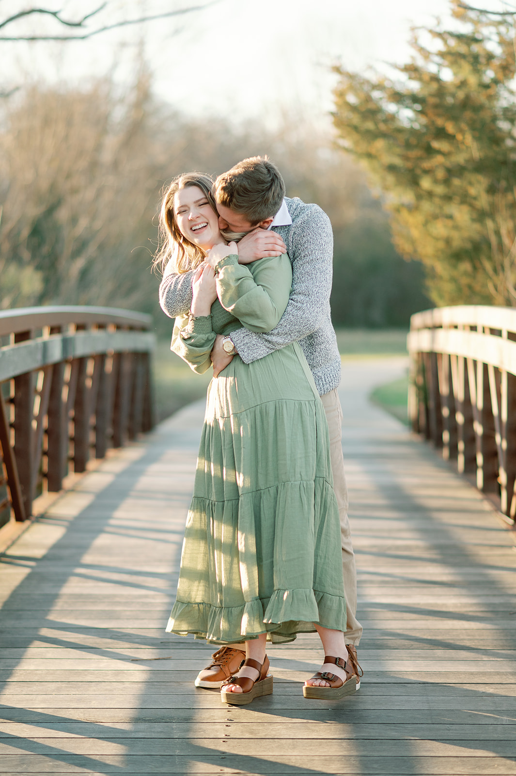 Outdoor engagement photography of a couple on a bridge in SULPHUR SPRINGS, Texas