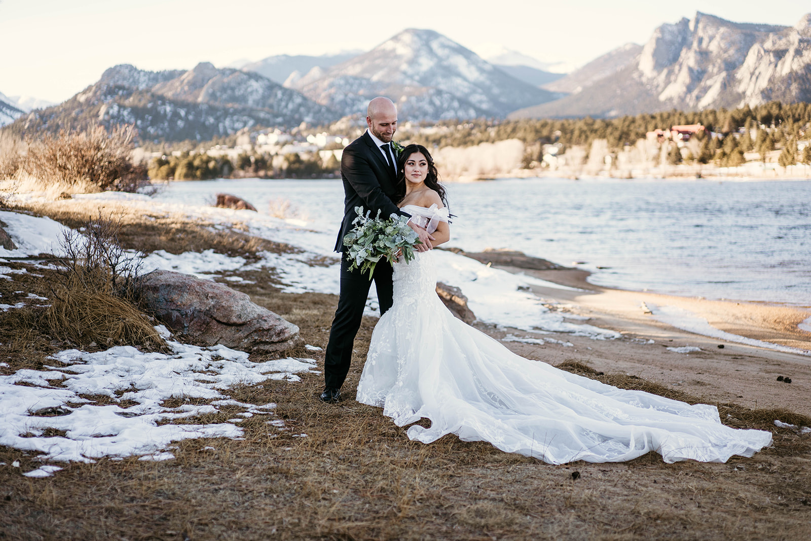 Mountain views during couples photos at winter mountain wedding at Black Canyon Inn in Estes Park, Colorado