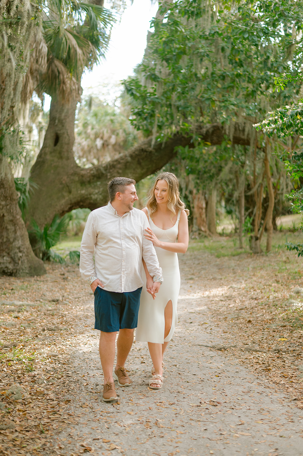 "Loving engagement photo in Tampa's Philippe Park"
