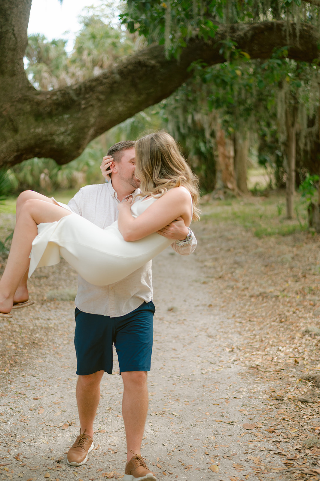 "Romantic waterfront engagement photo in Tampa's Philippe Park"
