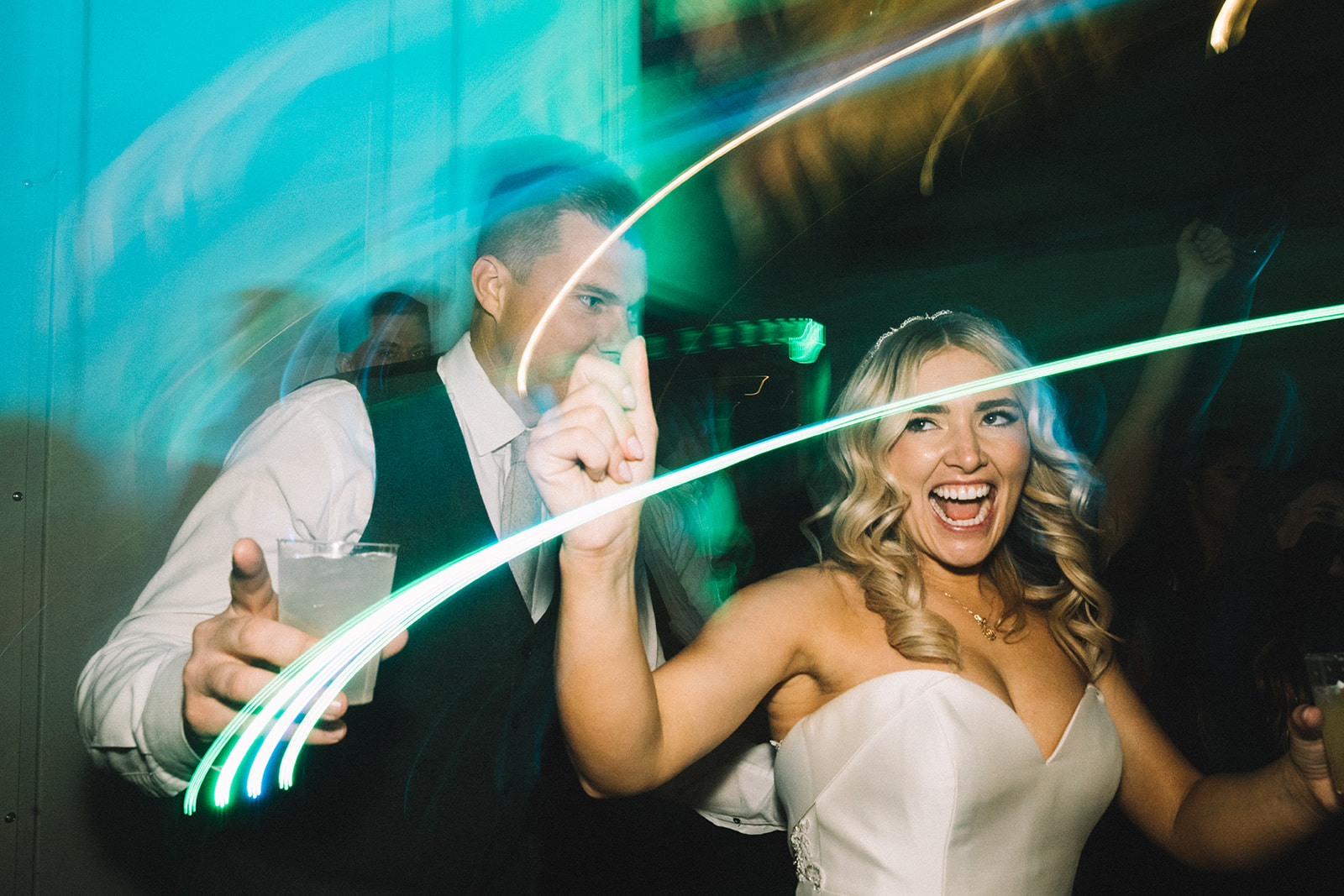 Couple celebrates their wedding night with signature cocktails and dancing the night away. 