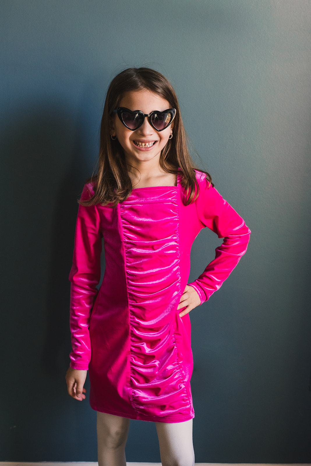 GIrl in pink dress and sunglasses