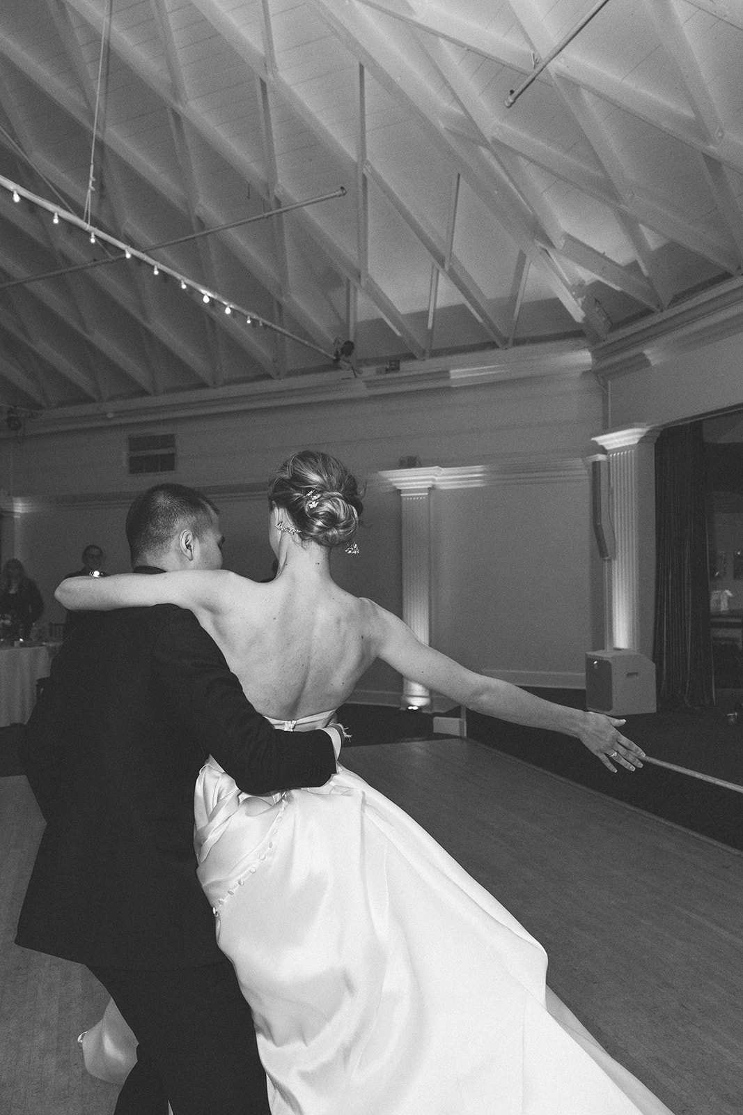 Couple has their choreographed first dance at the Casino San Clemente at the beach in California. 
