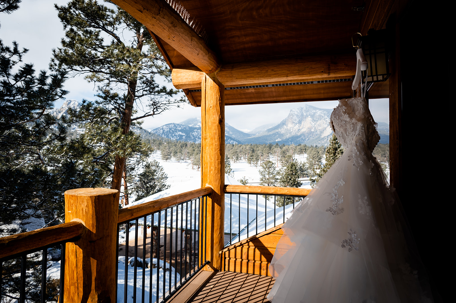a dress hangs outside a bridal suite in the Rocky Mountains of Colorado