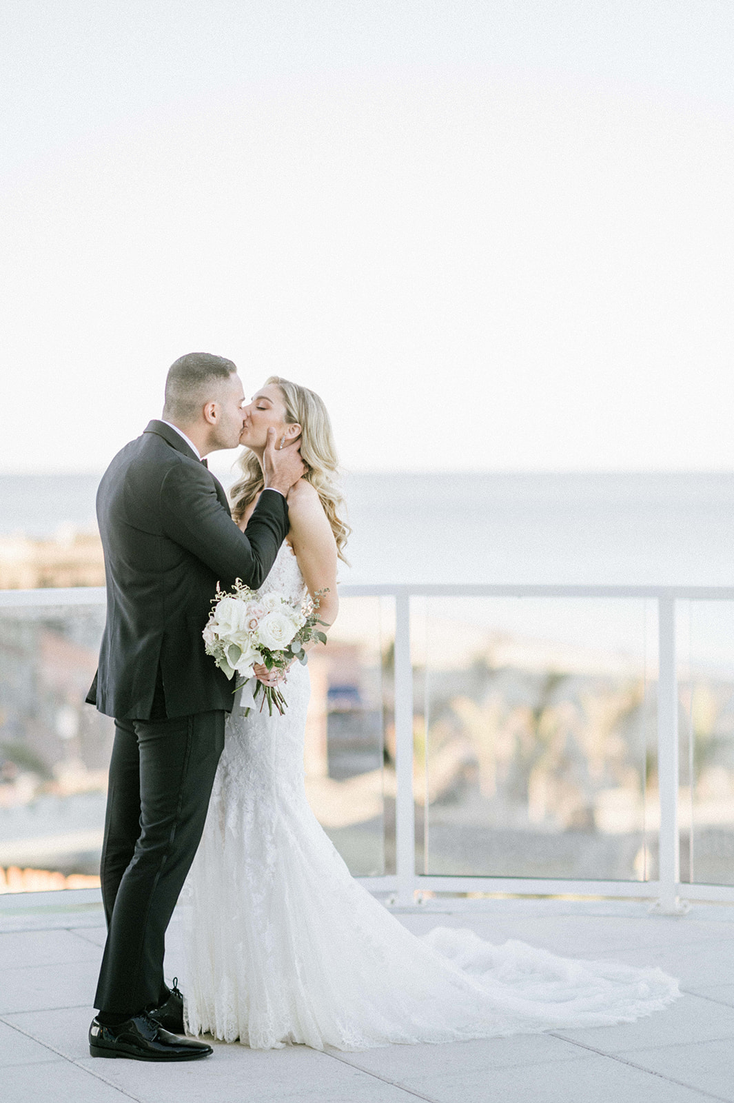 Bride and groom kiss at the Wave Resort