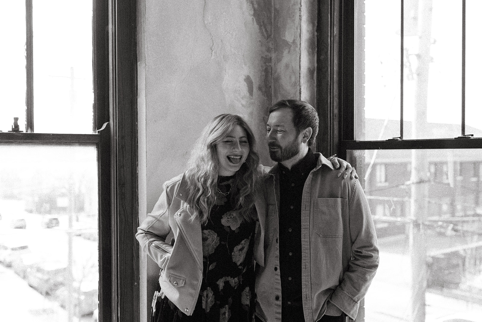 black and white photo of couple laughing during cincinnati engagement photo session