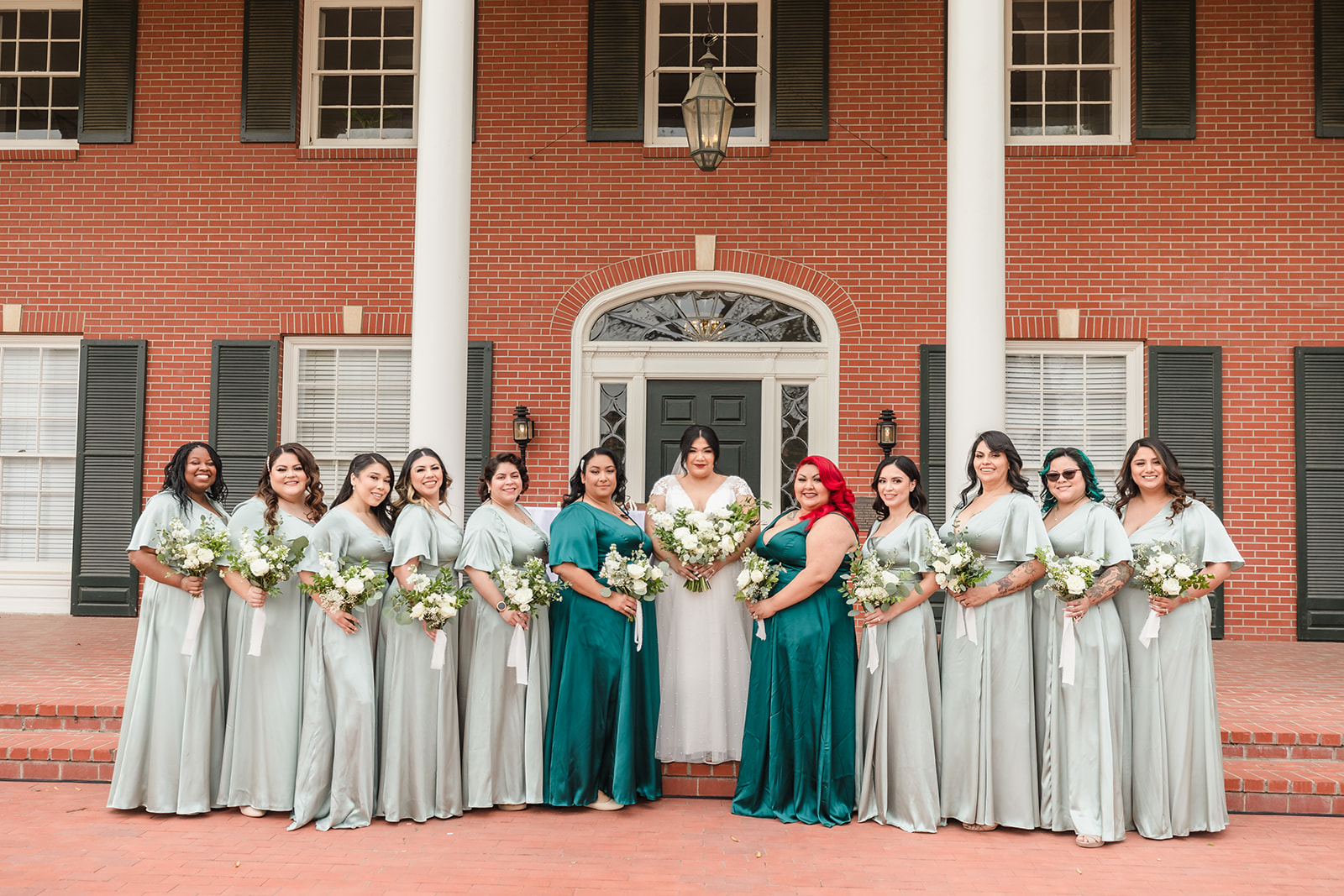 Bride and her bridesmaids on the front steps of Crestmore Manor