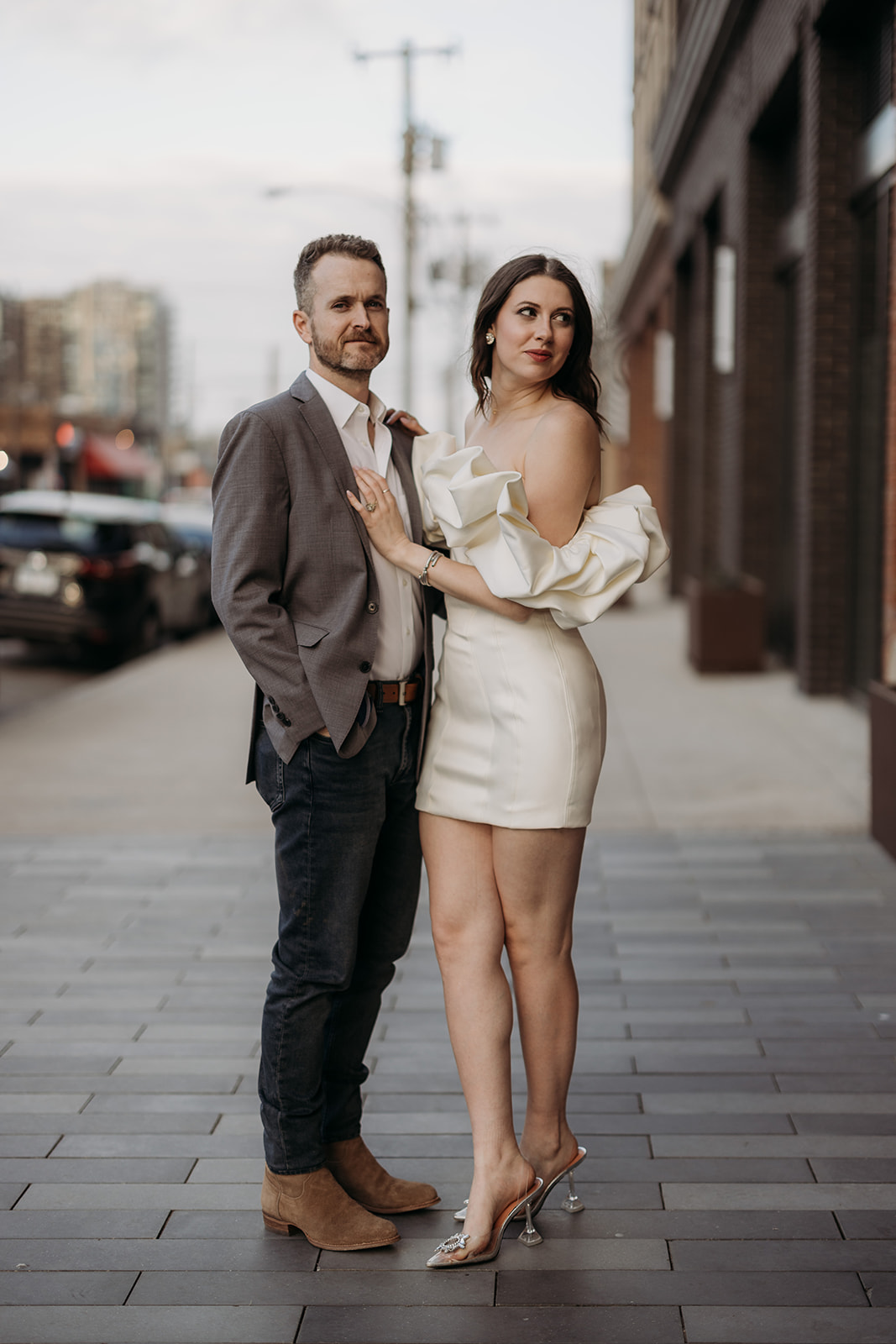 A chic, downtown dallas engagement session filled with pool, dive bars, and a traveling tiktok dress.