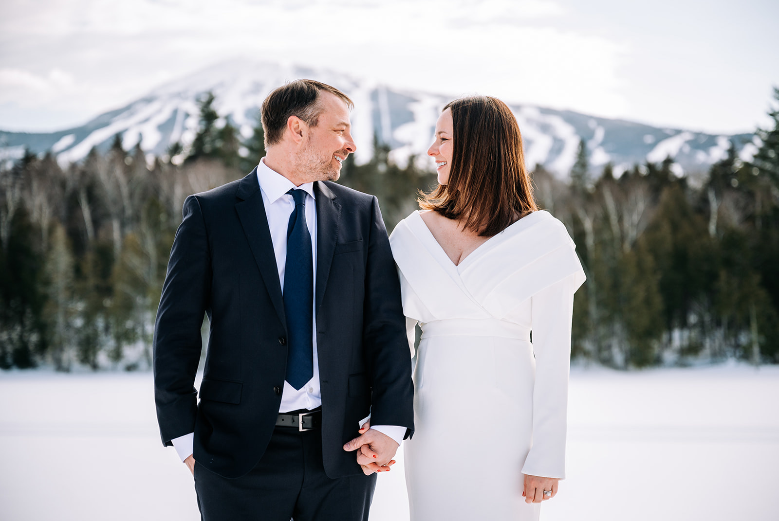 couple eloping in the winter in the mountains of maine