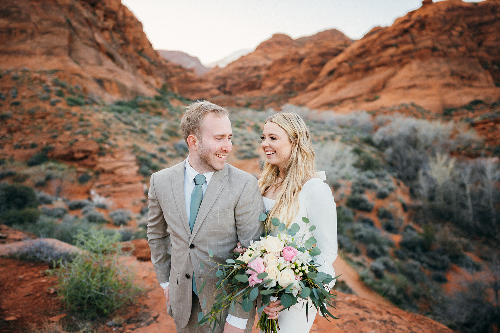 couple smiles at red cliffs reserve