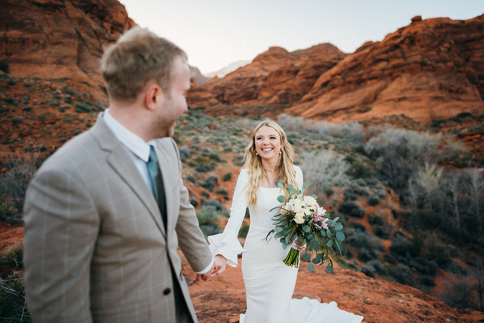 Wedding photos in the red rock cliffs of Southern Utah.