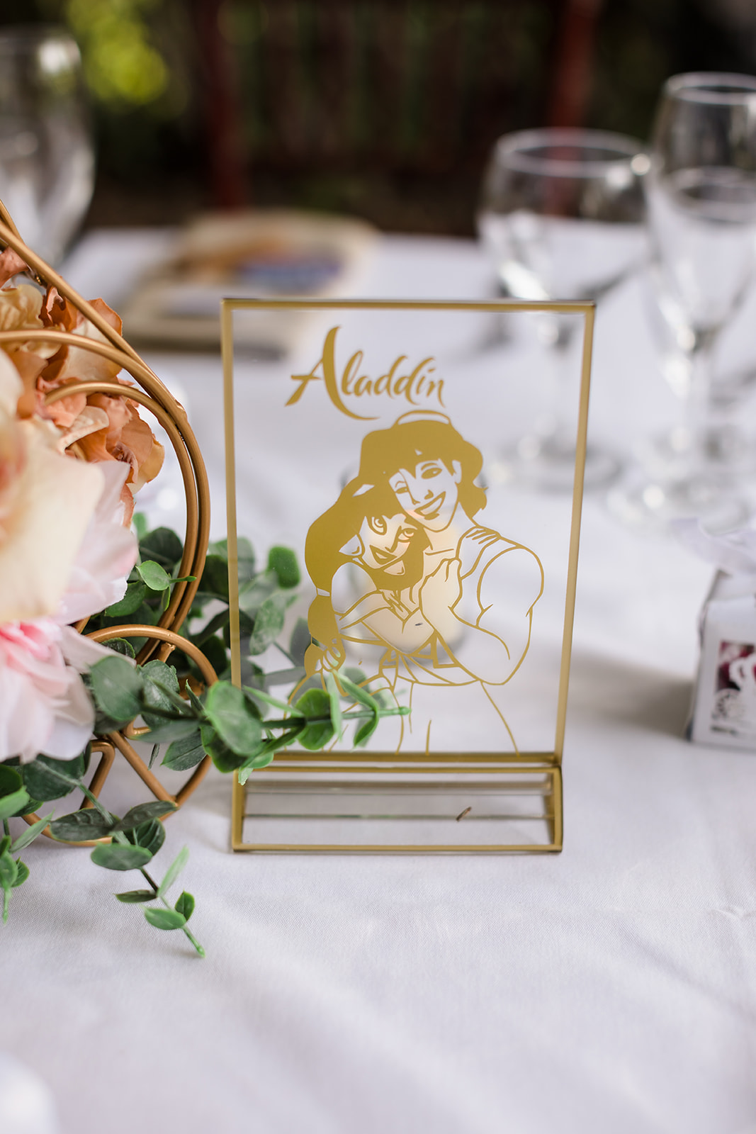 Aladdin wedding reception table markers made from glass with gold printing