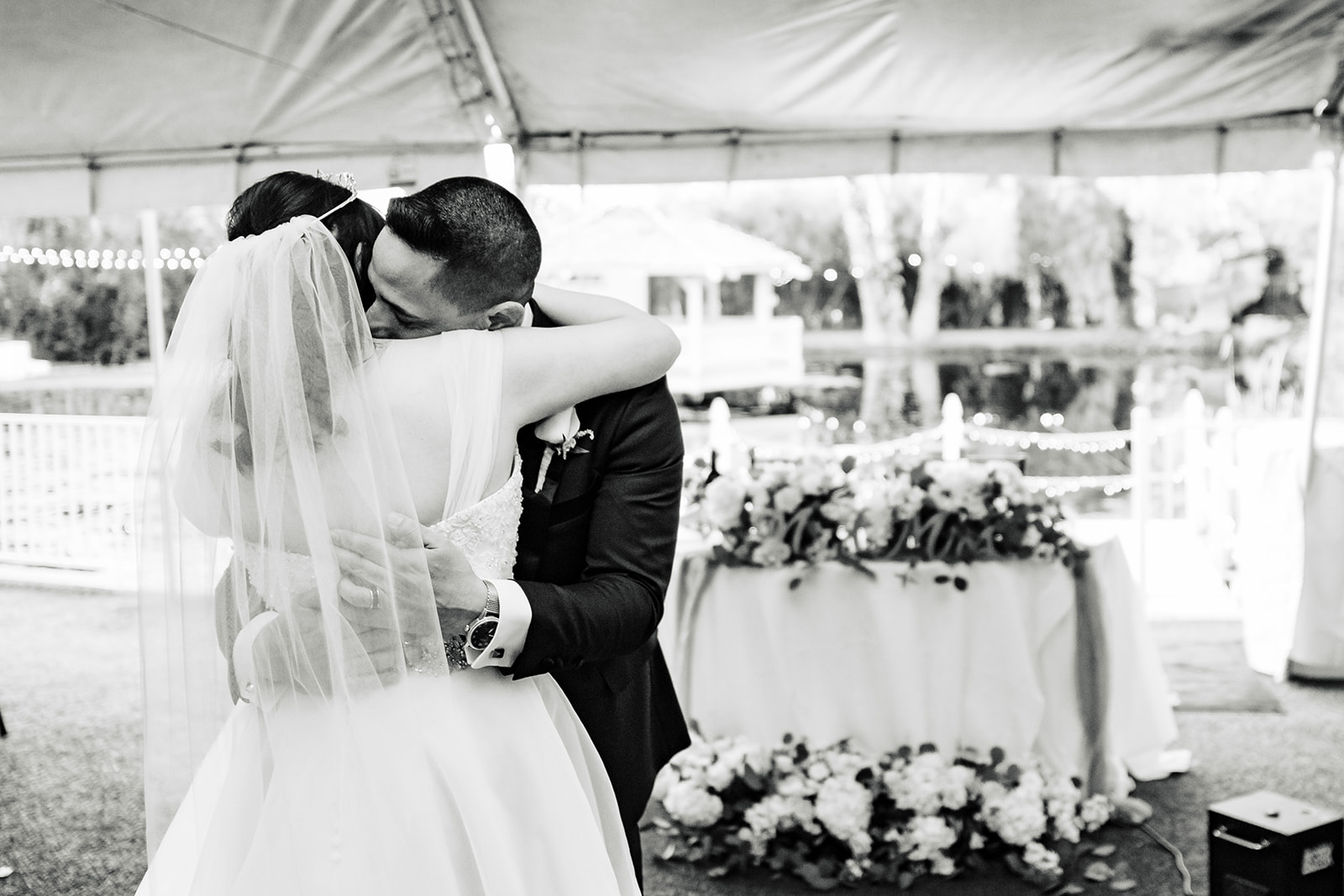 Newlyweds share dance under their reception tent