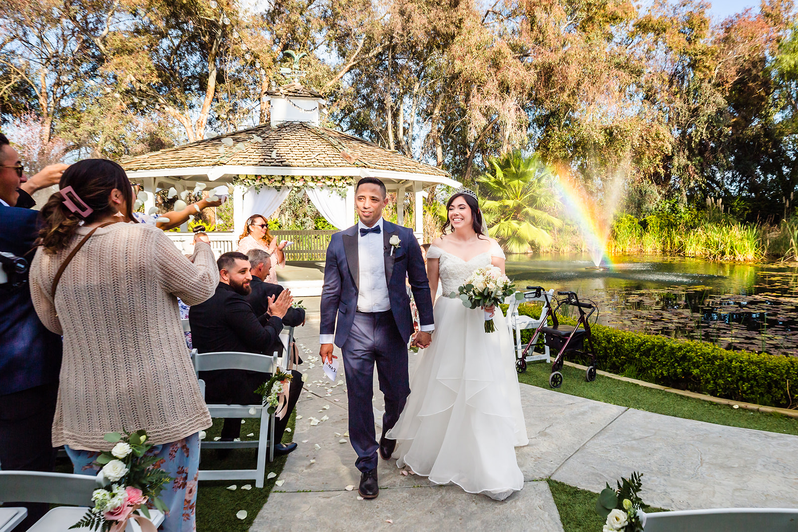 Newlyweds walk down the aisle together at The Orchard by Wedgewood in Menifee, CA