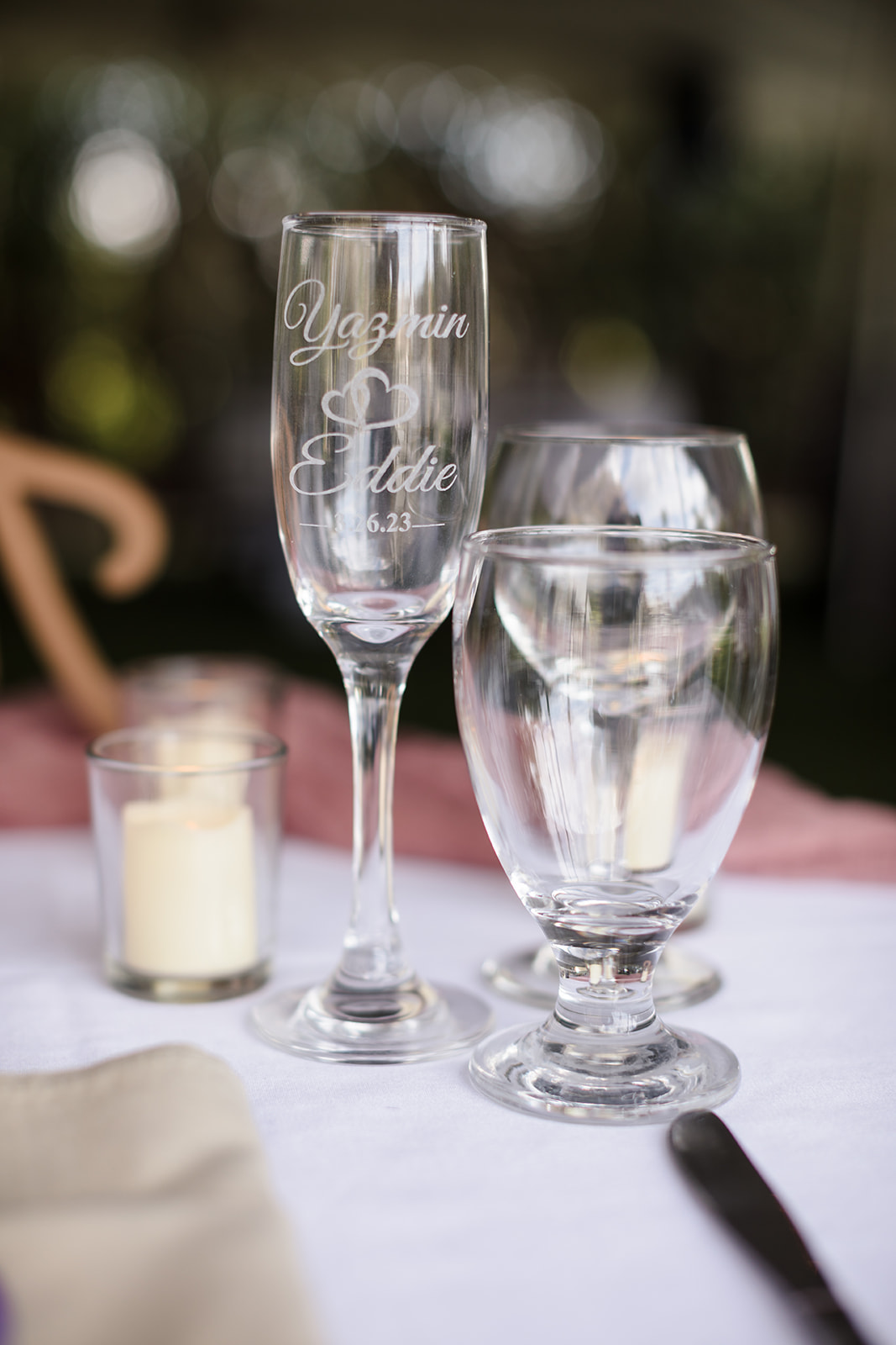 Custom engraved champagne glasses at the Newlywed's sweetheart table