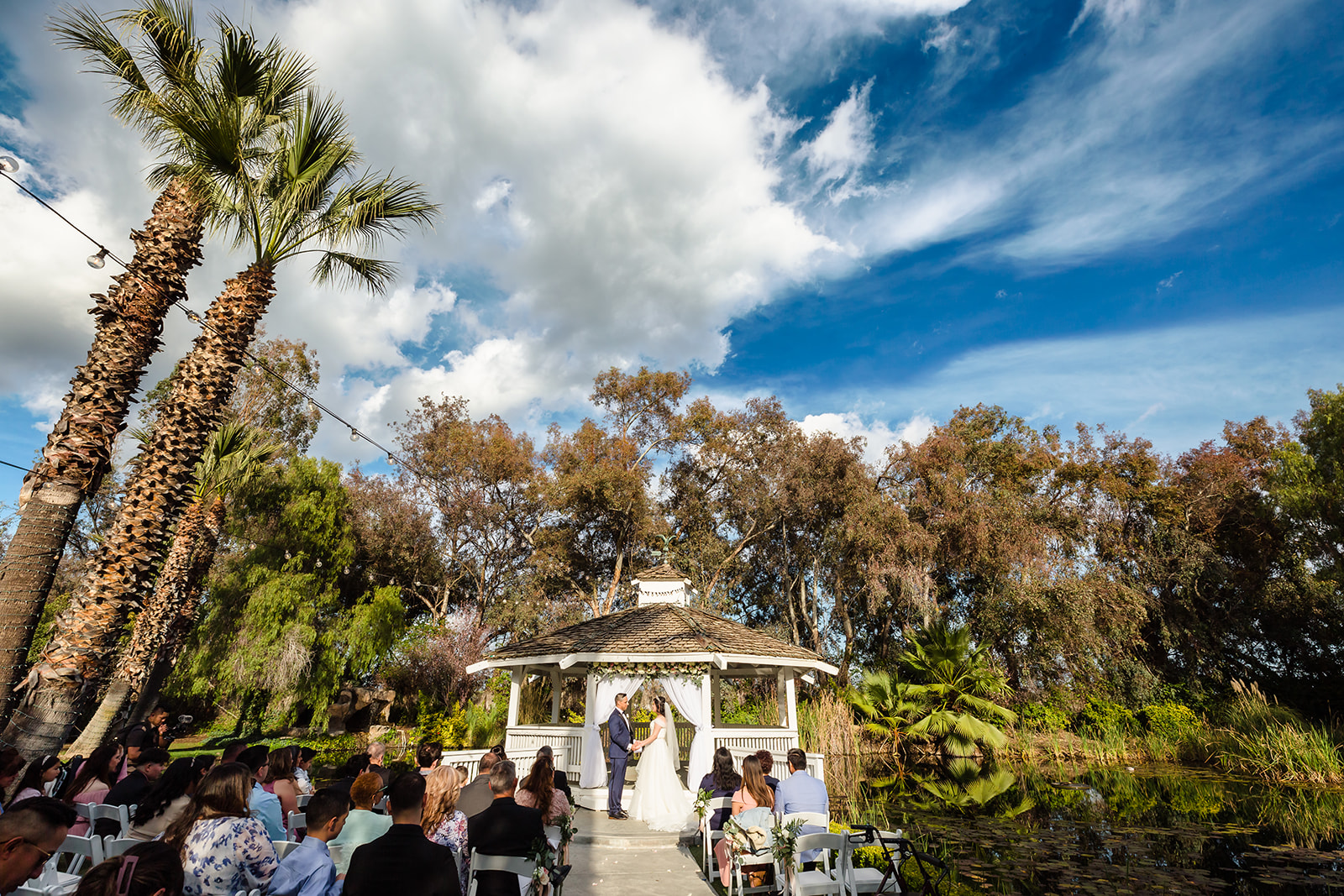 A wide-angle view of a wedding ceremony at The Orchard in Menifee, CA