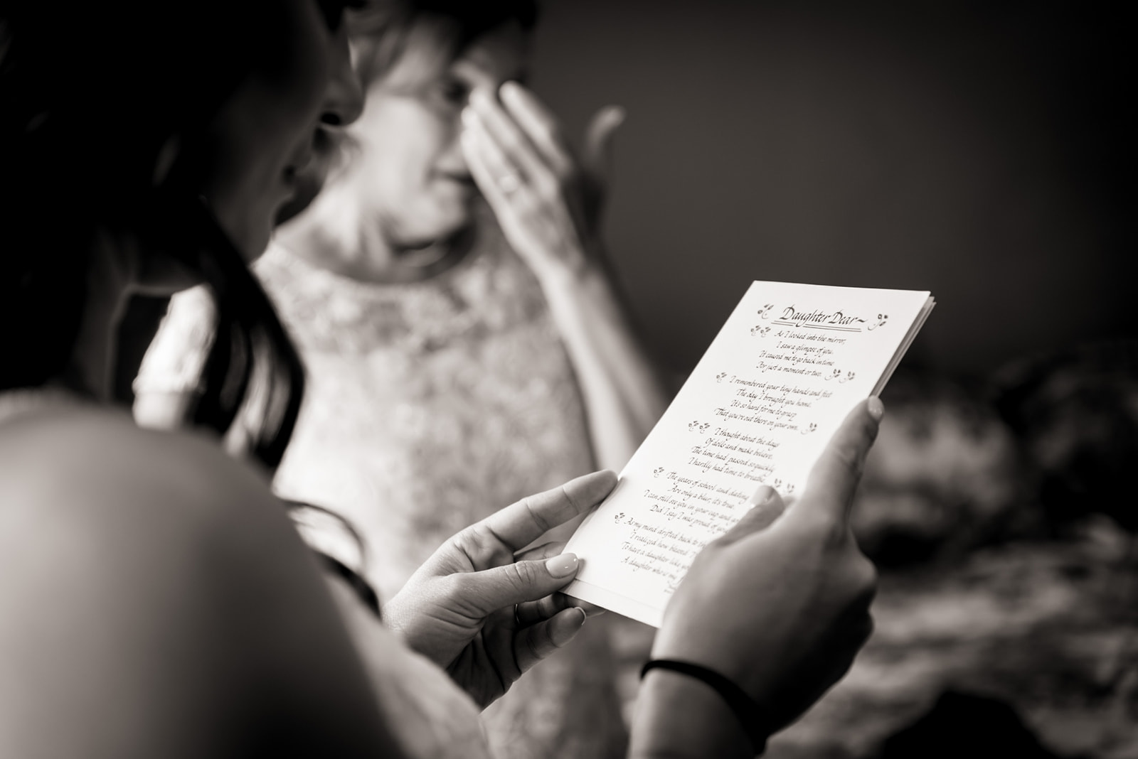 a bride reads a letter from her future husband at her Wedgewood mountain view ranch wedding