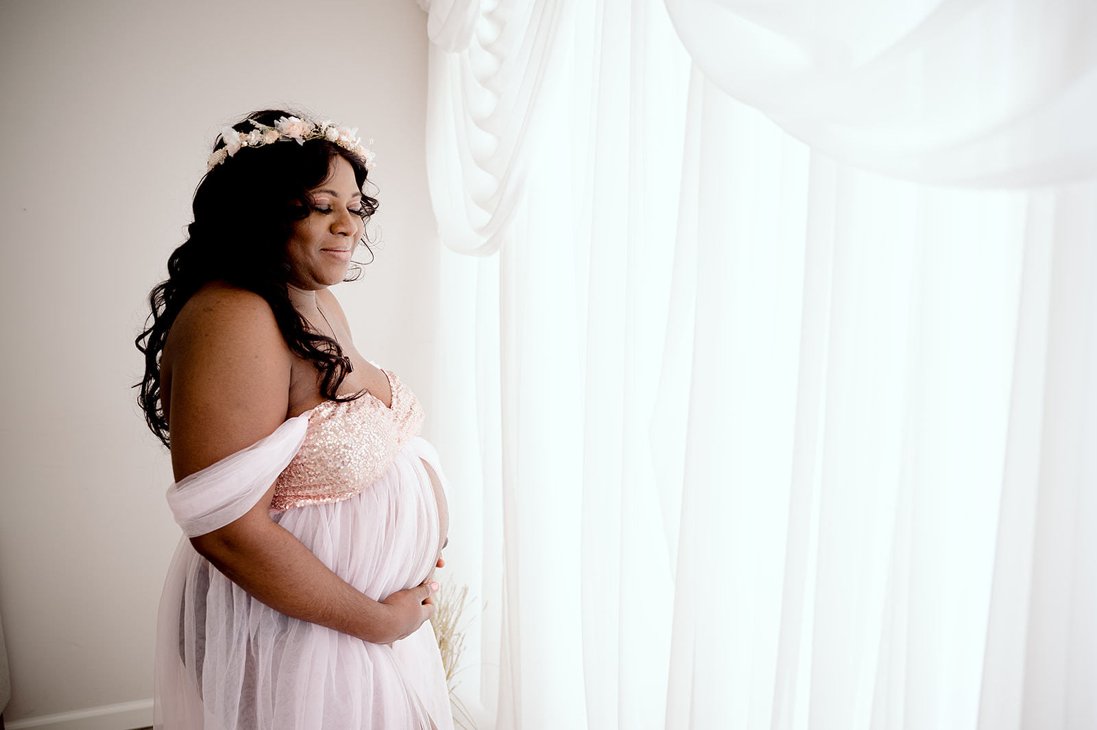 Central Minnesota maternity photographer with a studio and a client closet full of maternity gowns.