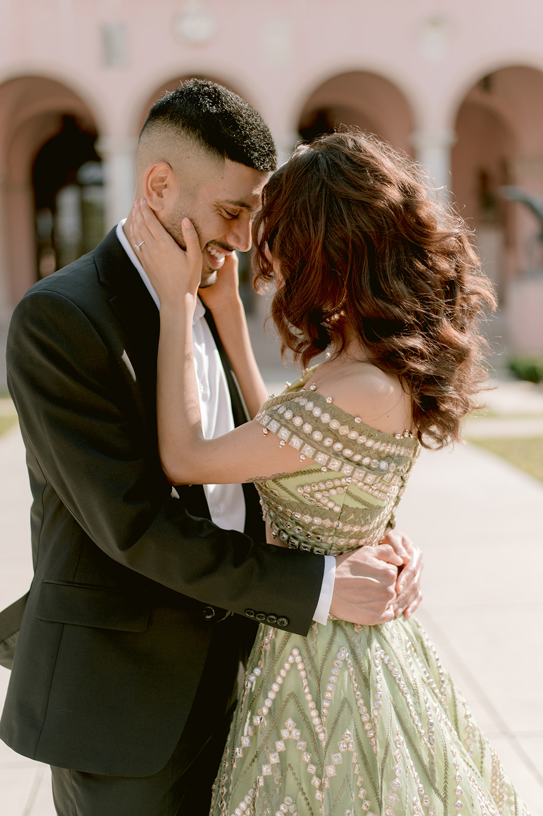 "Beautiful couple captured in front of the Ringling Museum's Ca' d'Zan mansion"
